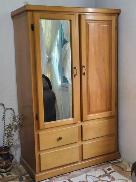 Wooden wardrobe with mirror and drawers
